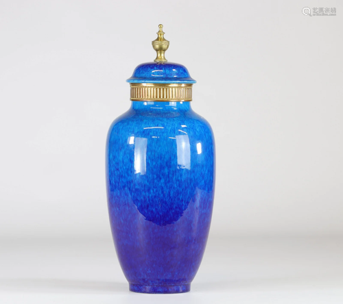 Sevres porcelain covered vase on a blue and bronze