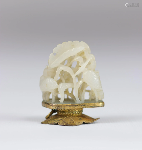 White jade carved with cranes in vegetation, 18th C.