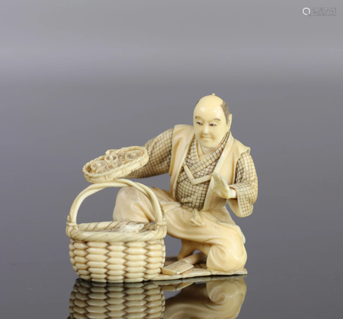 Japan Finely carved okimono of a man discovering a 19th