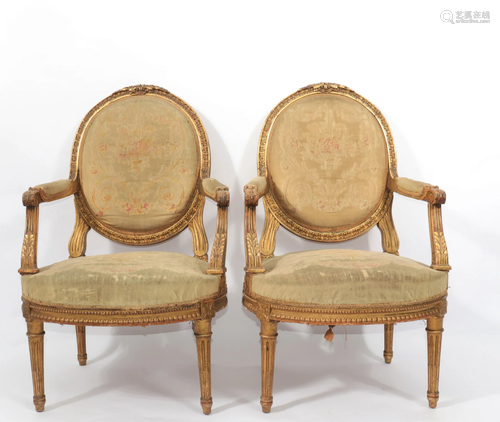 Pair of Louis XVI period armchairs in carved and gilded