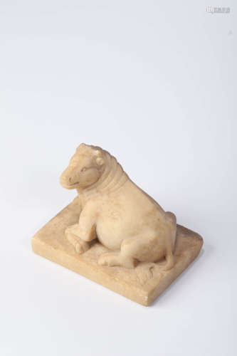 A Carved White Stone Recumbent Buffalo