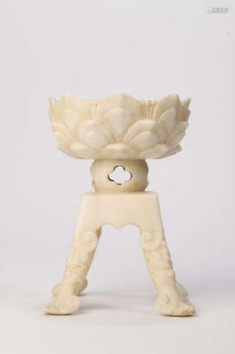 A Carved White Stone Lotus-Petal Candlestick