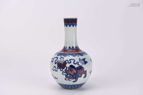 An Iron-Red Glaze and Underglaze Blue Lion Bottle Vase