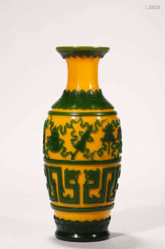 A Green Overlay Yellow Glass Buddhist Eight Treasures Vase