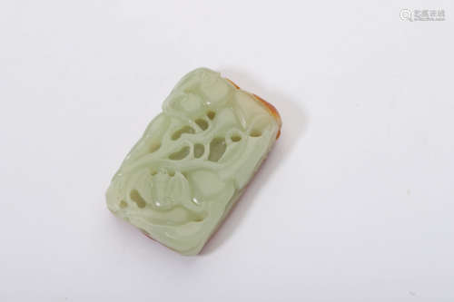 A Carved Russet and Celadon Jade Bat Pendant