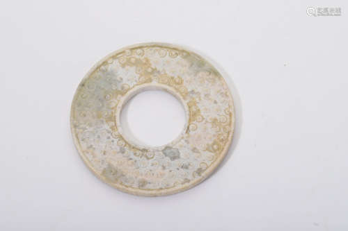 A Carved Chicken Bone Jade Disc Bi