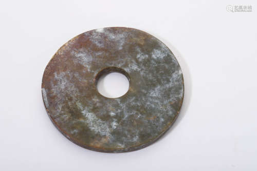 A Carve Brownish and Celadon Jade Disc Bi