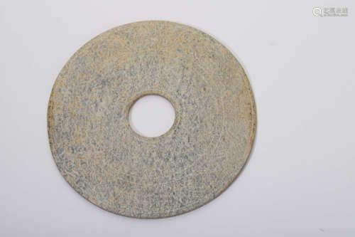 A Carved Brownish Jade Annular Disc Bi