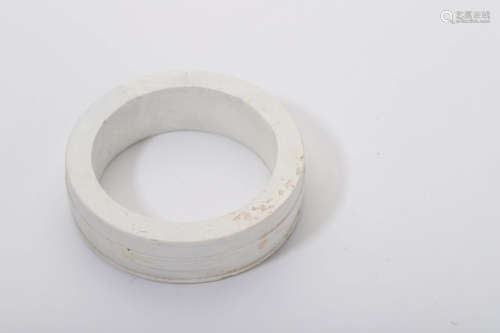 A Carved Chicken Bone White Jade Bangle