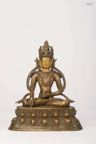 A Gold Painted Copper Alloy Figure of Vairocana