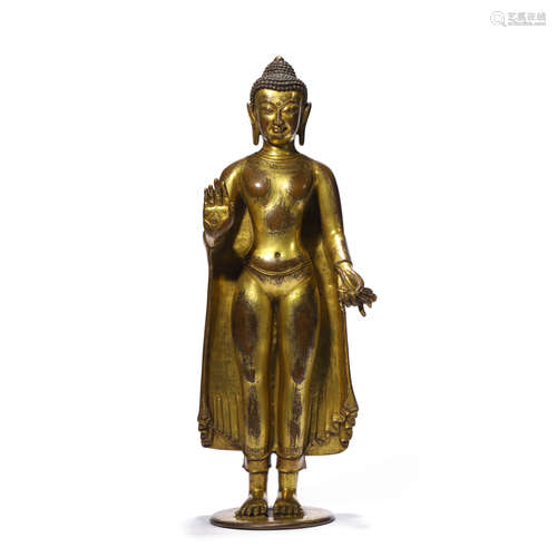 A GILT BRONZE FIGURE OF SHAKYAMUNI