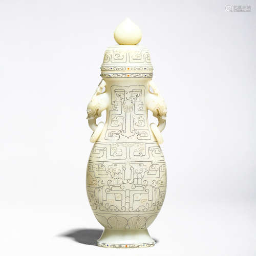 A CARVED WHITE JADE DOUBLE-EARED VASE
