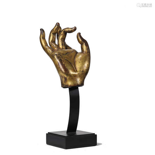 A GILT BRONZE HAND OF BUDDHA