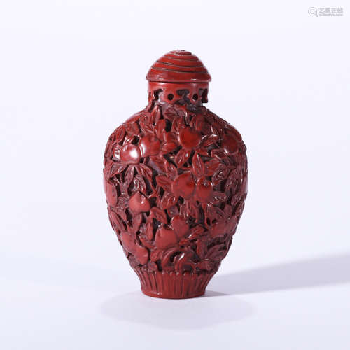 A CARVED CINNABAR LACQUER PEACH SNUFF BOTTLE