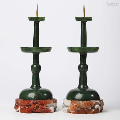 A PAIR OF SPINACH-GREEN JADE CANDLESTICKS