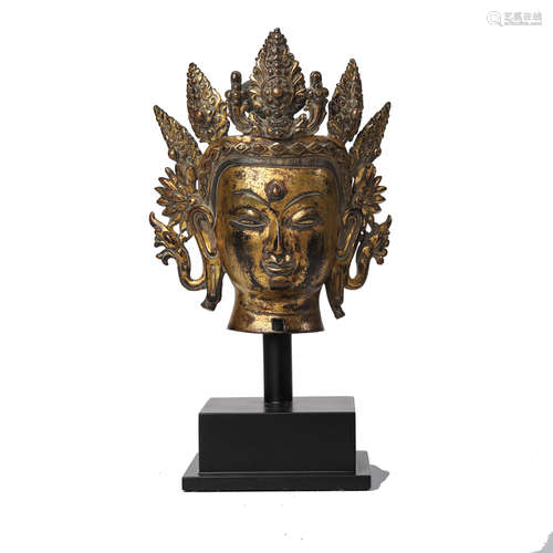 A GILT BRONZE HEAD OF AVALOKITESVARA