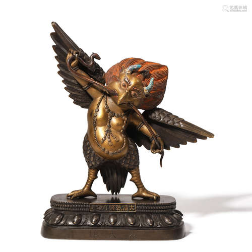 A GILT BRONZE STANDING GARUDA