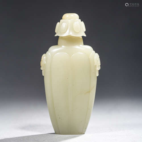 A CARVED JADE LOBED VASE AND COVER