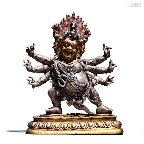 A GILT BRONZE FIGURE OF THREE-HEADED AND SIX-ARMED MAHAKALA