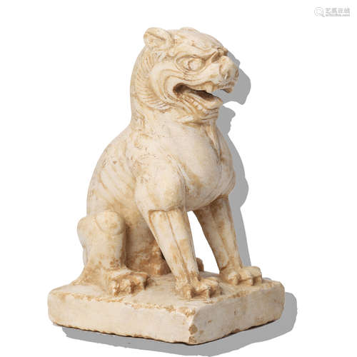 A CARVED MARBLE STONE LION