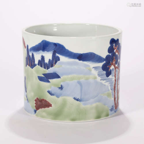 AN UNDERGLAZE BLUE AND WUCAI LANDSCAPE BRUSH POT