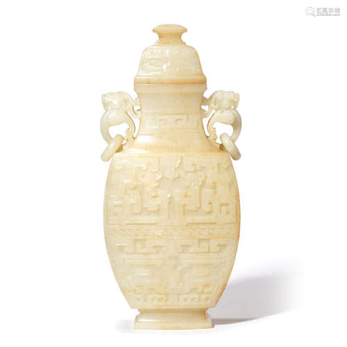 A CARVED WHITE JADE ARCHAIC STYLE VASE AND COVER