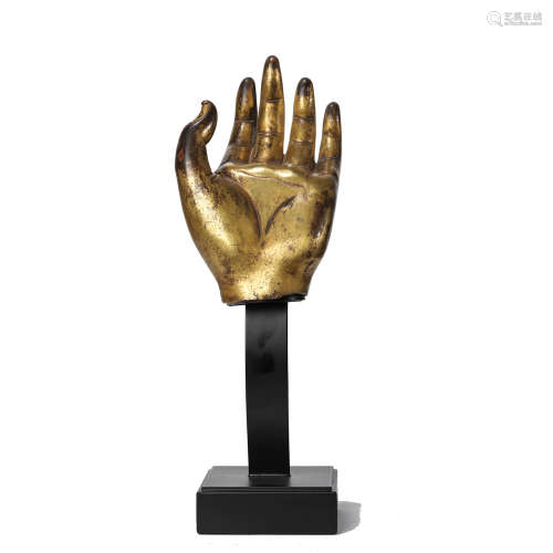 A GILT BRONZE HAND OF BUDDHA