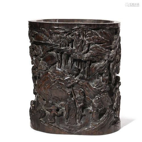 A CARVED SANDALWOOD FIGURE AND PINE BRUSH POT