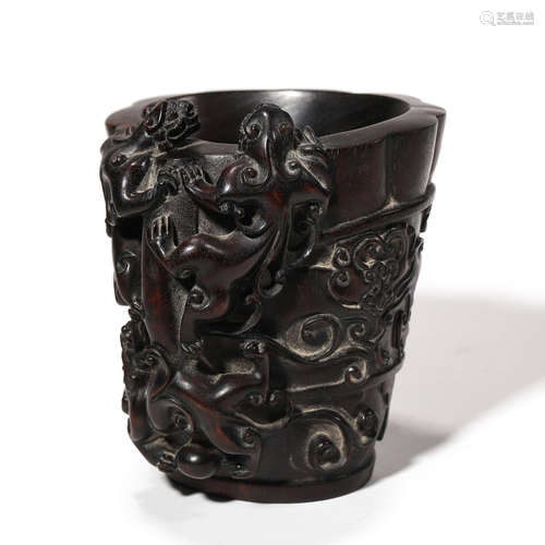 A CARVED SANDALWOOD DRAGON BRUSH POT