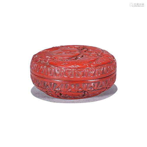 A CARVED CINNABAR LACQUER FIGURE BOX AND COVER