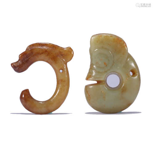 TWO CARVED CELADON JADE DRAGON ORNAMENTS
