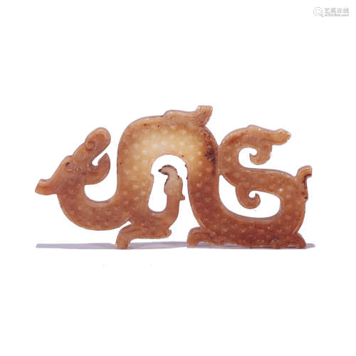 A CARVED RUSSET JADE DRAGON PENDANT