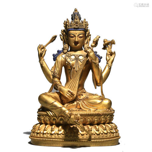 A GILT BRONZE FIGURE OF AVALOKITESVARA