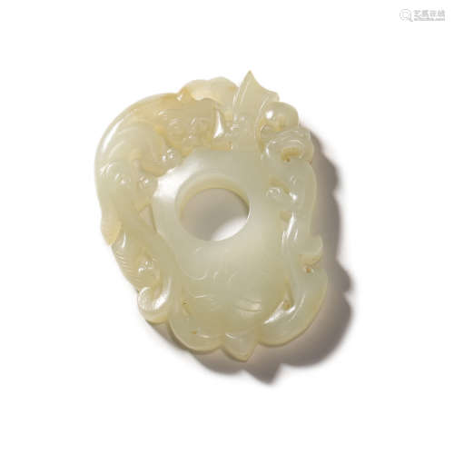 A CARVED JADE DRAGON ORNAMENT