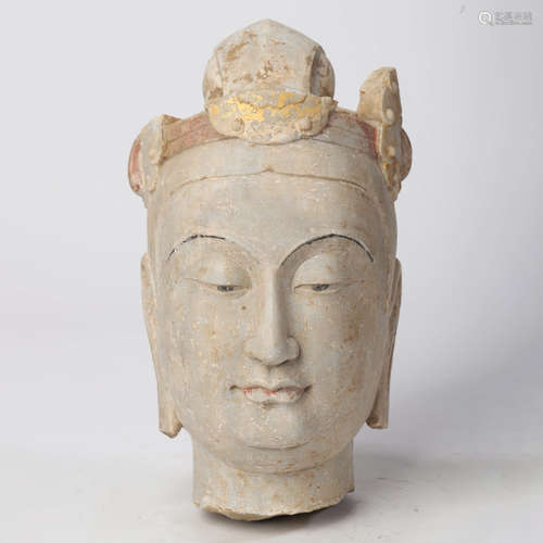 A CHINESE CARVED STONE HEAD OF BUDDHA