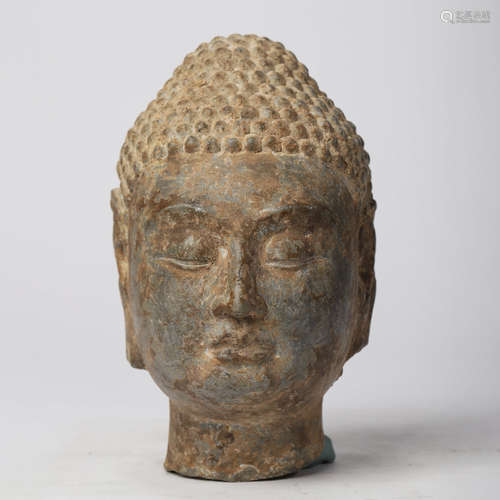 A CHINESE CARVED STONE HEAD OF BUDDHA