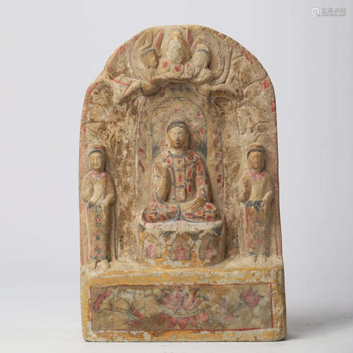 A PAINTED STONE BUDDHA WITH TWO ATTENDANTS