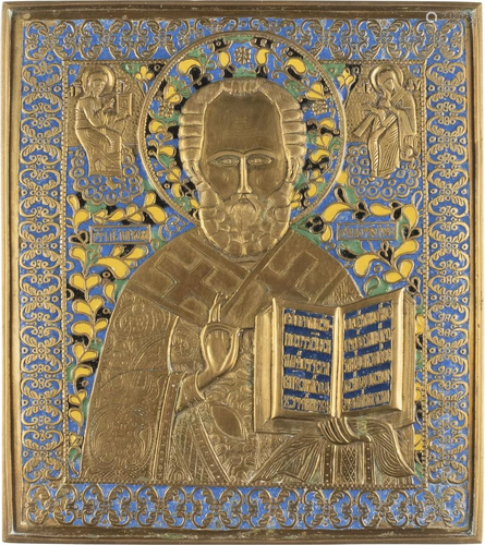 A LARGE BRASS AND ENAMEL ICON SHOWING ST. NICHOLAS OF