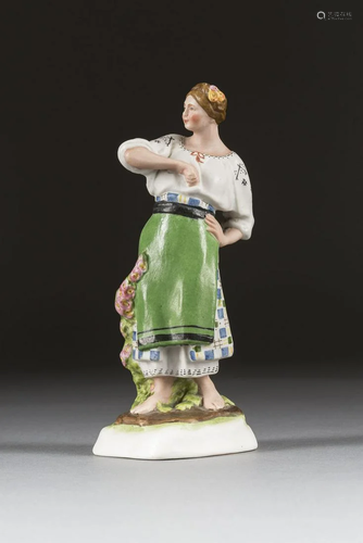 A SOVIET BISCUIT PORCELAIN FIGURE SHOWING A PEASANT