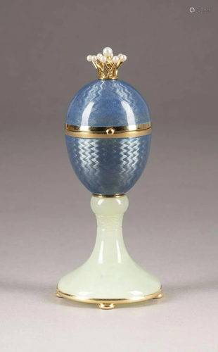 A GOLD AND GUILLOCHÃ‰ ENAMEL EGG-SHAPED BOX WITH S…