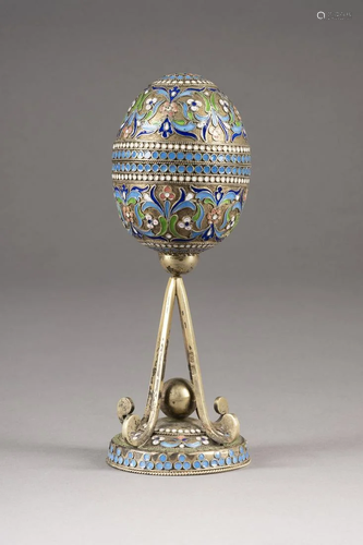 A SILVER-GILT AND CLOISONNÃ‰ ENAMEL EGG ON S…