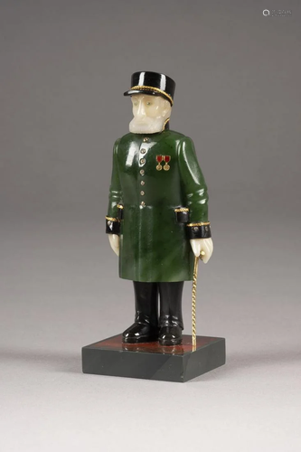 A CARVED HARDSTONE MODEL OF A MAN IN UNIFORM