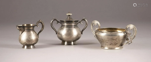 A SILVER SUGAR BOWL WITH COVER, A CREAM JUG AND A SUGAR