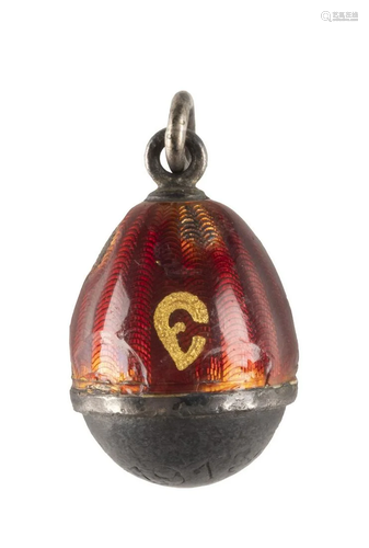 AN EGG PENDANT WITH A BULLET FROM THE WORLD WAR I