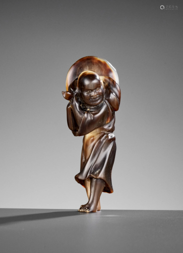 A RARE AND LARGE HORN NETSUKE OF A FOREIGNER