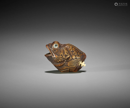 AN UNUSUAL AND FINE WOOD NETSUKE OF A FISH HEAD