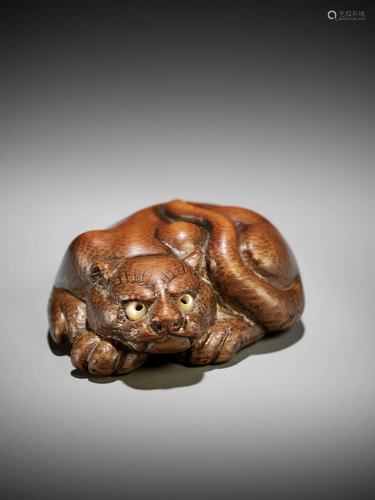 A VERY RARE BAMBOO NETSUKE OF A RECLINING TIGER