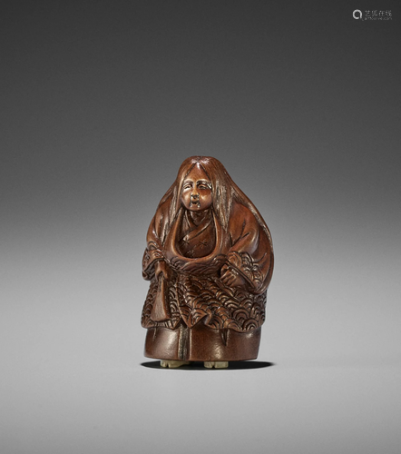 A FINE EDO SCHOOL WOOD NETSUKE OF A NOH ACTOR