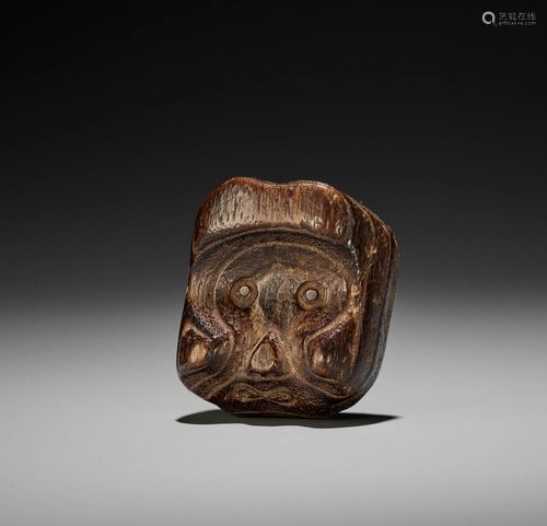 AN UNUSUAL KIRI WOOD MASK NETSUKE OF A KAPPA