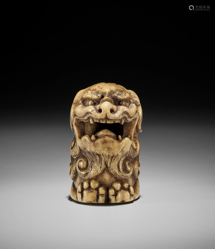 A KYOTO SCHOOL STAG ANTLER NETSUKE OF A SHISHI